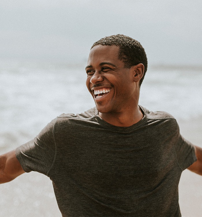 Happy man outside on the beach