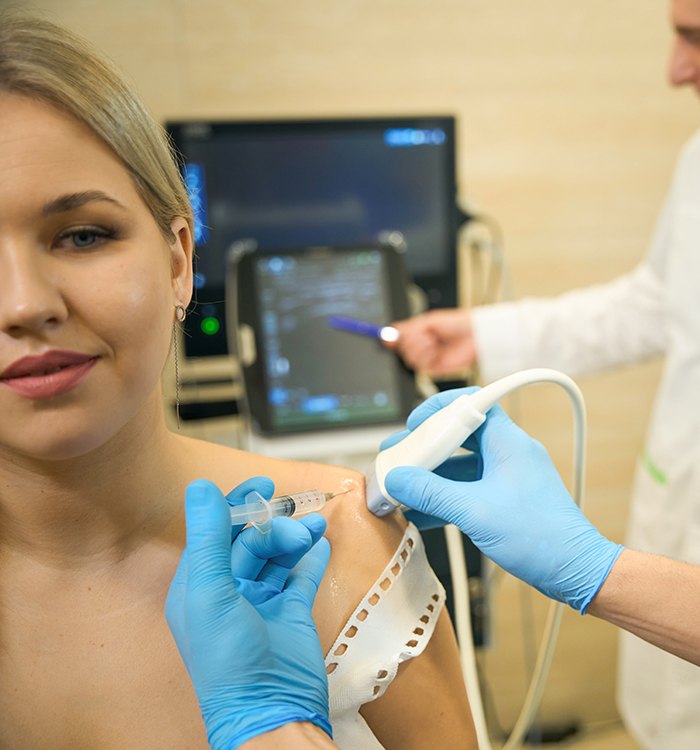 Patient receiving ultrasound-guided injection