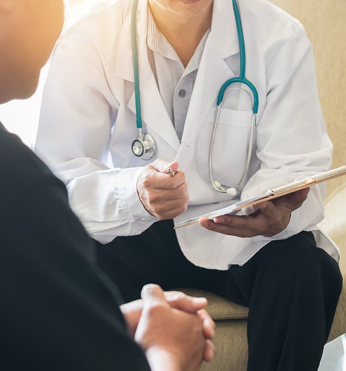 Doctor and patient talking during consultation