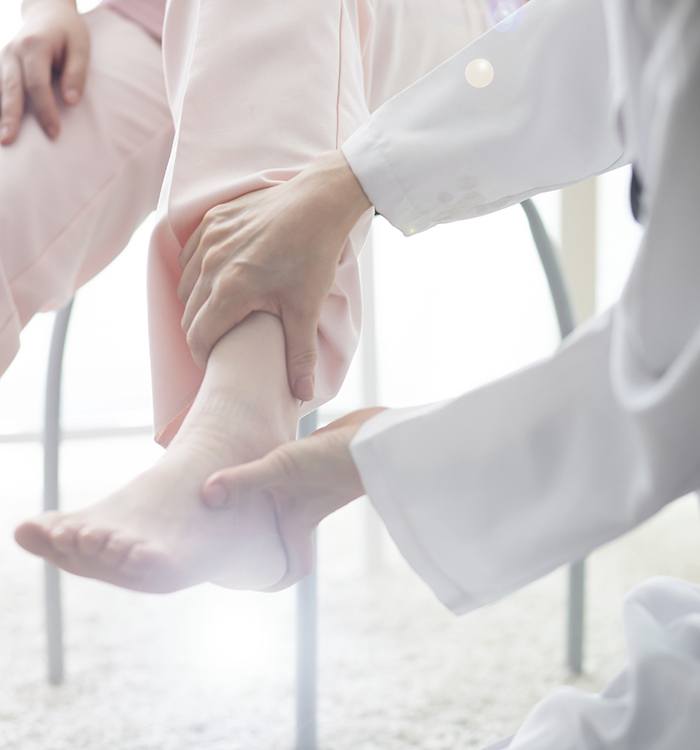 Doctor examining patient’s foot and ankle