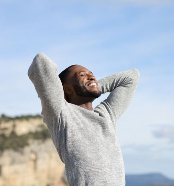 Happy, smiling man enjoying time outdoors