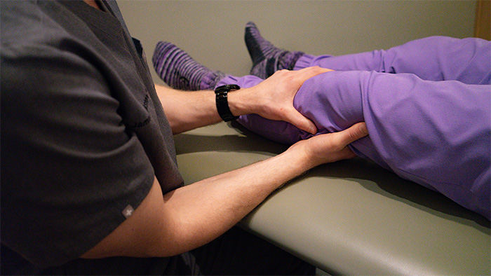 Physician performing osteopathic manipulative treatment