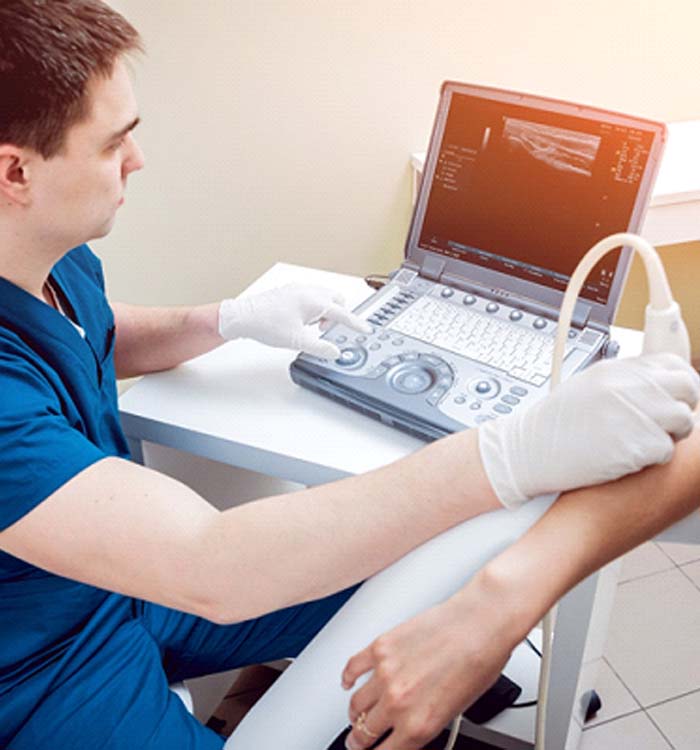 doctor scanning a patient’s elbow