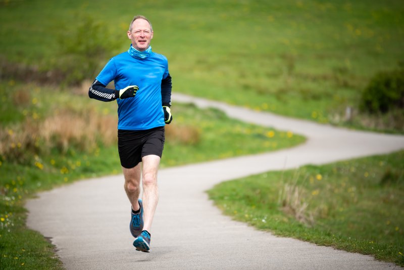 middle-aged man running 